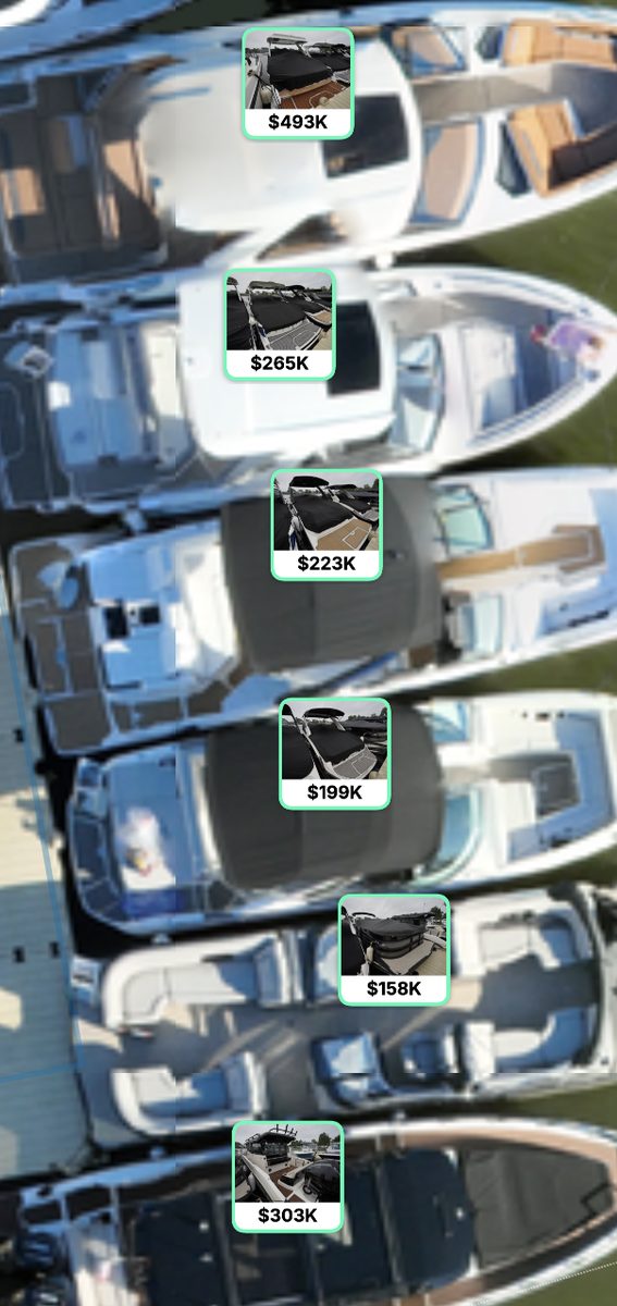 Boats at a dock tagged with photos and prices